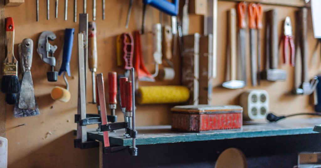 alt="tools hanging on a tidy workbench" 