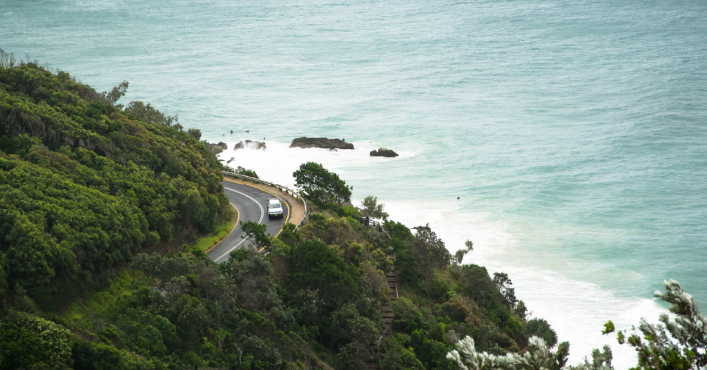 car driving along byron bay coast