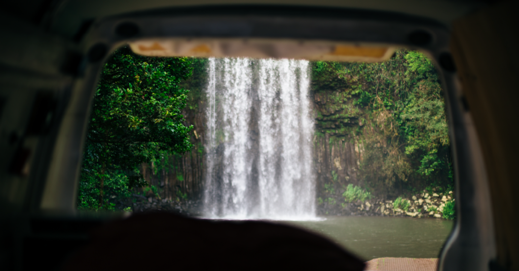 view of millaa millaa falls from inside the back of a van, road trips
