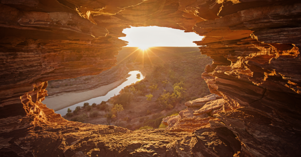 view of the sunset from inside of a rock cave at Kalbarri National Park