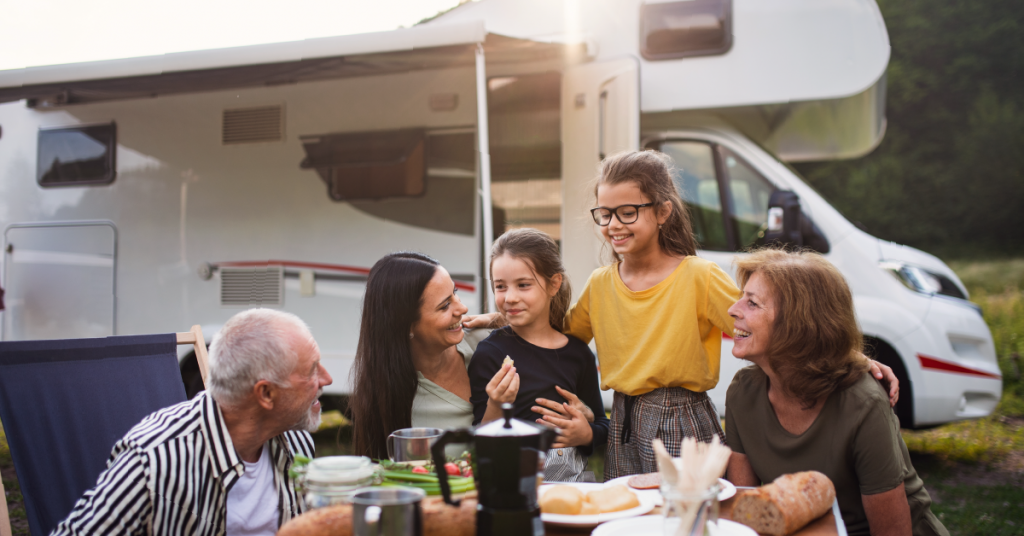 family gathering at camping table